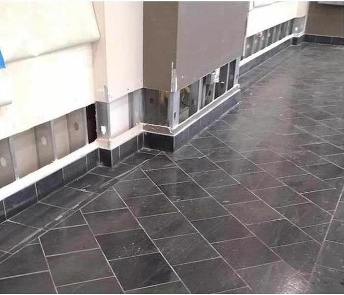 clean tiled floor with floodcuts on a wall