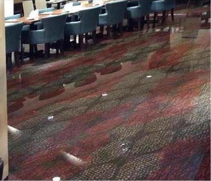 flooded carpet in a business conference room