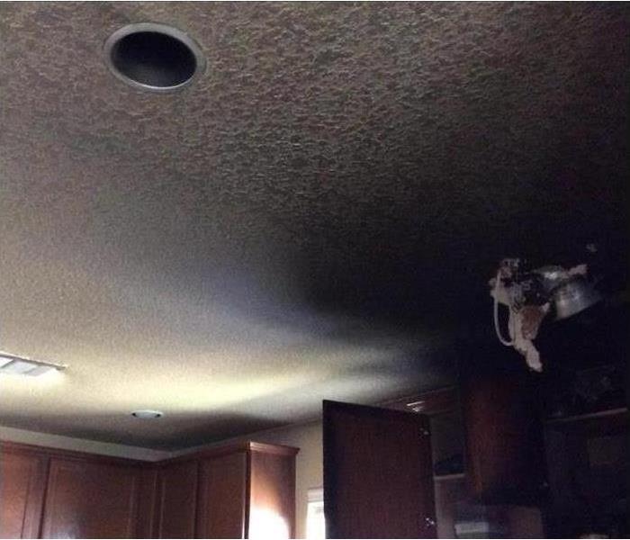 ceiling covered in smoke residue