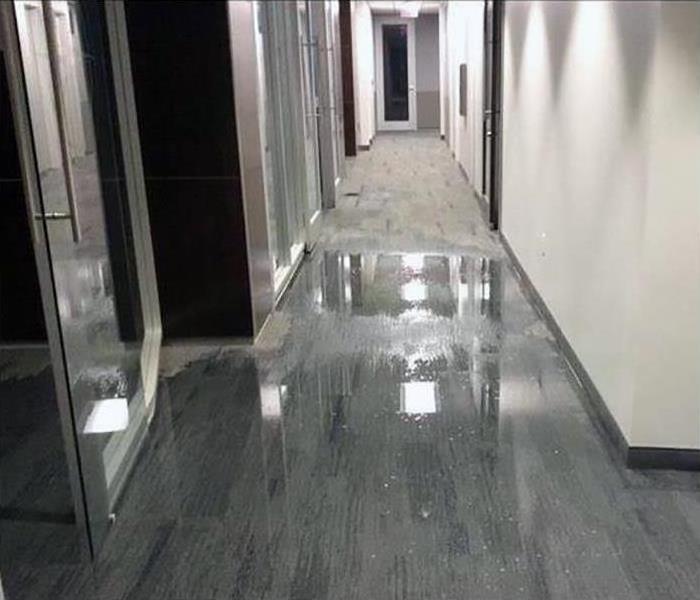 flooded corridor with grey floor